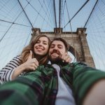 Beautiful,Happy,Couple,Taking,Selfie,Self-portrait,On,Brooklyn,Bridge,,New