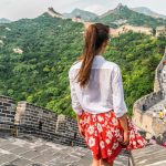 Young,Girl,Tourist,From,Behind,Looking,At,View,Of,Great