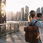 Back,View,Of,Stylish,Female,Tourist,With,Traveling,Backpack,Standing