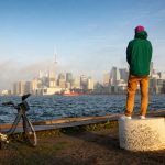 Man,With,Bicycle,Watching,Sunset,Over,Lake,Ontario,Waterfront,And