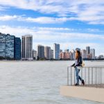 Female,Tourist,Admiring,Chicago,Cityscape,From,The,Viewpoint