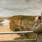 Female,Tourist,Lady,Taking,Photo,Using,Smartphone,At,The,Twelve