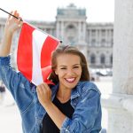 Happy,Young,Woman,Holding,Austrian,Flag,In,Vienna,,Austria