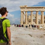 Tourist,Looking,At,Parthenon,,Acropolis,Ruin,,Athens,,Greece