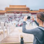 Enjoying,Vacation,In,China.,Travel,And,Technology.,Young,Woman,With