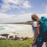 Traveler,Woman,With,Backpack,Looking,The,Ocean