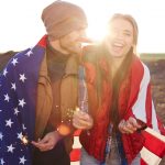 Portrait,Of,Happy,Couple,Wearing,Fashionable,Tourist,Clothes,Laughing,And