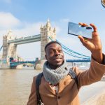 Smiling,Black,Man,Taking,Selfie,In,London,With,Tower,Bridge