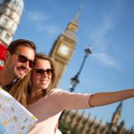 Couple,Of,Tourists,In,London,Holding,A,Map
