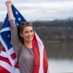 Pretty,Young,Woman,Holding,American,Flag