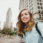 Happy,Young,Woman,Takes,Selfie,Photo,Near,Flat,Iron,Building