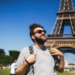 Happy,Smiling,Young,Male,Backpacker,Tourist,Staying,In,Front,Of